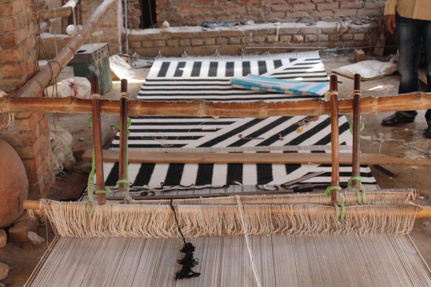 Image showing a loom which a flatwoven rug is constructed on by using traditional weaving techniques