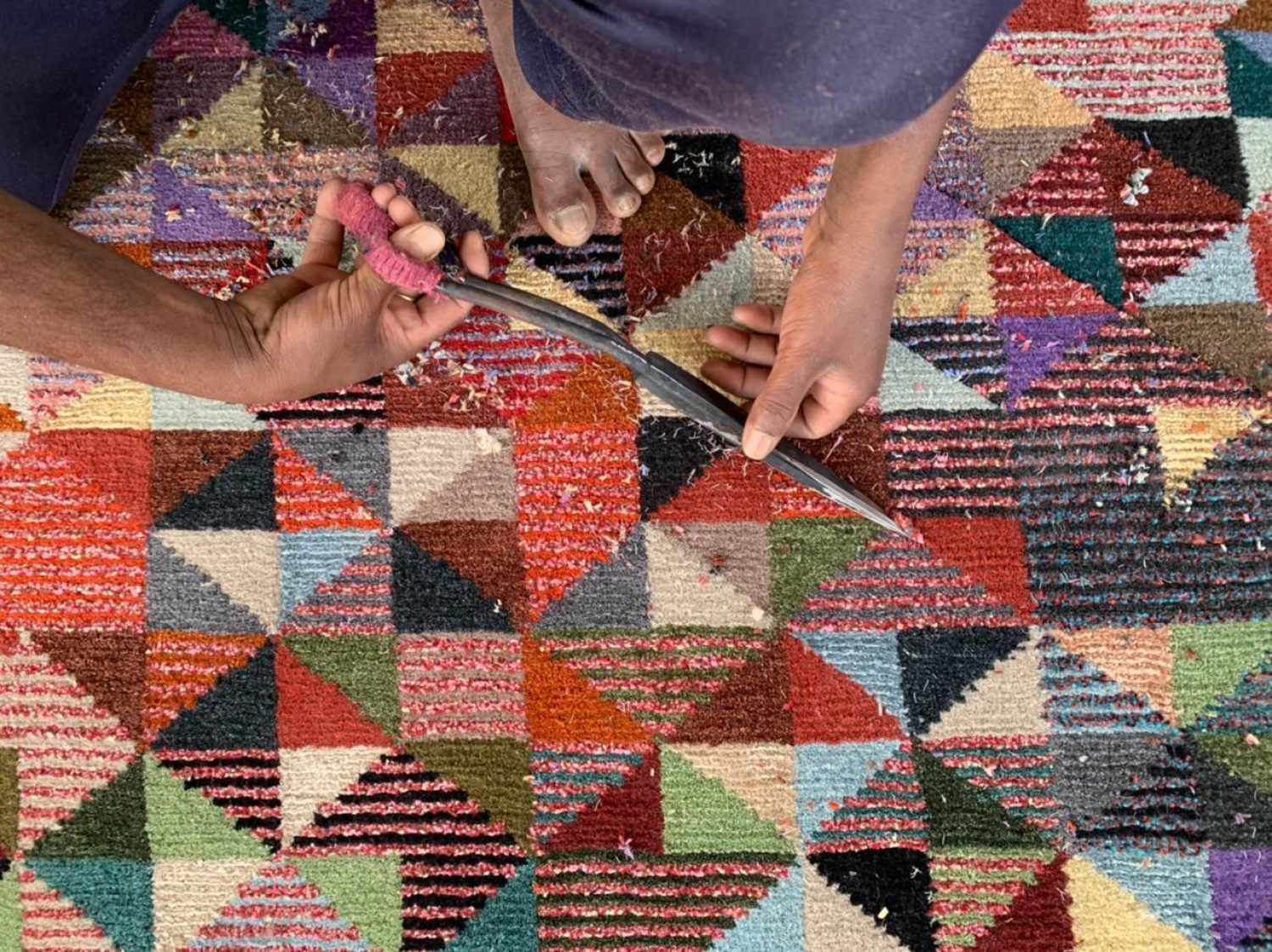 The finishing processes of a Hand Knotted geometric design Wasted rug