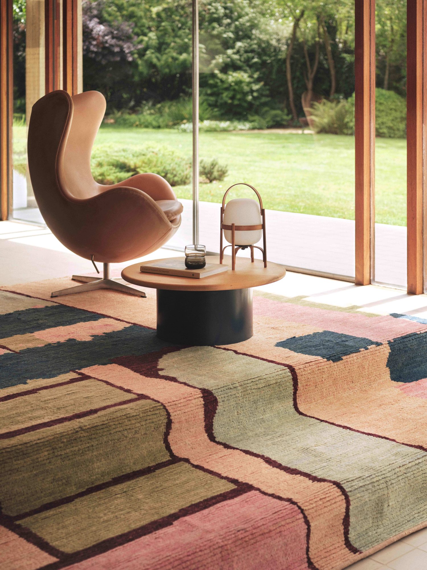 A high pile wool rug from our VERSO collection, used as a insulating textural underlay in a modern living space.